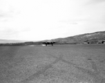 B-25 tail number 435, of the Ringer Squadron, above a runway in Yunnan.  From the collection of Wozniak, combat photographer for the 491st Bomb Squadron, in the CBI.