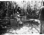 Local people in China: A woman feeds a baby. During WWII.  From the collection of Eugene T. Wozniak.