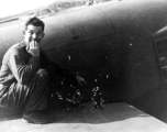 After returning to Liuzhou (Liuchow), China, Capt. Robert C. Pettingell, 491st Bomb Squadron Flight Leader, poses next to some of the damage received by the B-25J he was flying on a mission against White Cloud airfield near Canton in the spring of 1944.  (Info courtesy Tony Strotman)