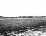 A row of P-51s in the CBI during WWII.  From the collection of Wozniak, combat photographer for the 491st Bomb Squadron, in the CBI.