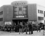 American GIs stand in front of market and and movie theater in Kunming, Yunnan province, China. During WWII.