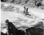 Local woman in Yunnan province, China, doing washing in a pond.  From the collection of Eugene T. Wozniak.