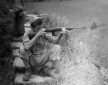 "Ralph O'Connor Taking Dead Aim At His Target While A Chinese Boy Looks On Hoping To Maybe Get Whatever He May Shoot."