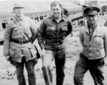 "The officer in the center is Lt. Sohl engineering officer of the 396th. The officer on the right is Capt. Weisburg a medical officer with the 396th. Unfortunately Lt.Sohl did not make it back to the states. He had his orders to return stateside and was awaiting transportation home when he was bitten by a rat and became very ill. Three days later he passed away. He was a fine officer respected by all that came in contact with him."