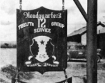 "Another Example Of Joe Goodman's Work. The 12th Air Service Group Emblem In Front Of Headquarters Building,Yang Tong Air Force Base, Kwelin (Guilin), China, 1944."