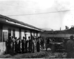 GIs line up at base supply at a base in China during WWII.