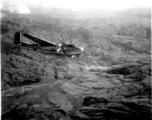 Smoke rises on the ground after an attack by American B-25s in either SW China, Indochina, or the Burma area.  This might be fairly close to Tengchong in China.