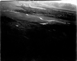 Smoke rises from B-25 Mitchell bombers attack during battle with Japanese ground forces, flying over Tengchung (Tengchong), near the China-Burma border in far SW China.