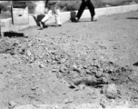 Result of explosives set on bridge by Americans in 1944 during retreat from Japanese in Guangxi province, China, during WWII.