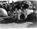 Chinese refugees shelter from the hot sun under paper umbrellas at the train station in Liuzhou during WWII, in the fall of 1944, as the Japanese advanced during the Ichigo campaign.