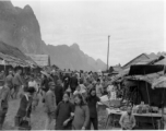 Bustling street scene of Chinese civilians and Nationalist soldiers not far from the south side of the floating bridge at Liuzhou, near the American air base, around the time of the evacuation of fall 1944.
