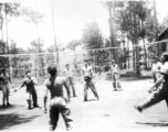 GIs play volleyball. in Yangkai, China, 1944. Art, Gross, Trombley, Kainne [Keiser?], Elmer Moore, Harry Leech, Lacher [or Lecher?], Alelunas, Doc Townsend  From the collection of Frank Bates.