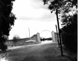 Guarded gates of the Nationalist Kunming Air Force Officer Training School during WWII, with C-46 transports.