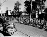 Chinese soldiers walking on a road in Kunming during WWII.