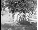 Solemn burial ceremony for American GIS who had died at a temporary war-time graveyard. In the CBI, during WWII.