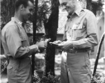 GIs count cash among pines at Yangkai air base during WWII.