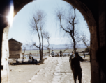 View out from a town gate in Yunnan, China, during WWII.