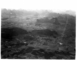 Aerial view of karst mountains and fields in either SW China or French Indochina, in the CBI, during WWII.