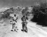 Photographer Eugene Wozniak and a language interpreter take a stroll about in Yunnan, China, during WWII.