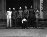 A group of local soldiers--likely a local militia or local KMT-affiliated warlord soldiers-- in Yunnan, China, during WWII. They are standing before a temple.