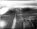 Aerial view of auto bridge and fields in either SW China or French Indochina, in the CBI, during WWII.