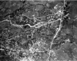 Bombing of large village area with evidence of much previous bomb damage in a region of savanna, either in Burma or French Indochina. During WWII.