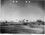 Japanese bombing of Kunming, December, 1943. The dirt pyramids are bomb bunkers.