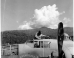 10CU 5G11 G Helicopter Salvage Secret. B-25J "Cornhusker," serial #43-3951, hard on the ground in China. A GI salvages gauges from the cockpit of the wrecked craft.