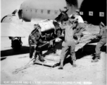 10AF 10Dec44 G180-2 U.S. infantry loading mules on [C-47] cargo plane, Burma.  10th Air Force.