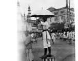 In the India during WWII: A diseased person next to railroad tracks (top), a police officer directing traffic in Calcutta in 1944 (middle), and farm people picking rice in Assam in 1944 (bottom).