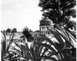 A small stone pavillion in the countryside.  Scenes in India witnessed by American GIs during WWII. For many Americans of that era, with their limited experience traveling, the everyday sights and sounds overseas were new, intriguing, and photo worthy.