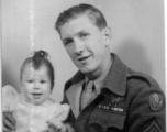 John Jacob Gerber, of the 322nd Troop Carrier Squadron, returned to the US and finally meeting his daughter, born September 1, 1944.