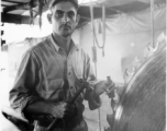 GI of the 797th Engineer Forestry Company in Burma, fixing saw blade in mill.  During WWII.