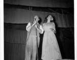 Performers well off the beaten track, providing a break for Burma Road engineers of the 797th Engineer Forestry Company--Pat O'Brien and Jinx Falkenburg perform  During WWII.