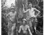 Engineers of the 797th Engineer Forestry Company pose against tree in Burma.  During WWII.