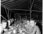 Engineers of the 797th Engineer Forestry Company eating meal at camp in Burma.  During WWII.