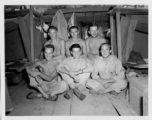 Engineers of the 797th Engineer Forestry Company pose in their barracks in Burma.  During WWII.