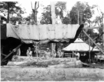 GIs wranging logs towards saw with cant pikes at a lumber mill of the 797th Engineer Forestry Company in Burma.  During WWII.