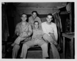 Engineers of the 797th Engineer Forestry Company pose in their barracks in Burma.  During WWII.