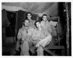 Engineers of the 797th Engineer Forestry Company pose in their barracks in Burma.  During WWII.