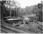 Site at the mill yard, of GIs sorting planks after ripping logs at a sawmill of the 797th Engineer Forestry Company in Burma.  During WWII.