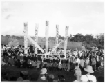 Kachin people dancing the manau dance, at the center of a Kachin community.  In Burma near the 797th Engineer Forestry Company.  During WWII.