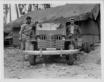 GIs of the 797th Engineer Forestry Company in Burma, pose with a jeep that has had chrome grill and bumper added on.  During WWII.