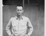 Engineer of the 797th Engineer Forestry Company poses before tent in Burma.  During WWII.