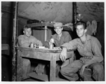 Engineers of the 797th Engineer Forestry Company pose in their barracks in Burma.  During WWII.