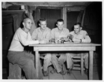 Engineers of the 797th Engineer Forestry Company pose in their barracks in Burma.  During WWII.