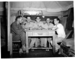 Engineers of the 797th Engineer Forestry Company pose in their barracks/tent in Burma.  During WWII.