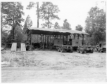 Engineers of the 797th Engineer Forestry Company at work at a truck repair garage at camp in Burma.  During WWII.