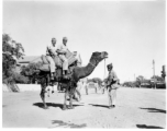 GIs riding camel in Burma or India.  Near the 797th Engineer Forestry Company.  During WWII.