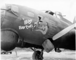 A B-17 bomber retrofitted with radar and new antenna (retrofitted directly over the nose art).  Aircraft in Burma near the 797th Engineer Forestry Company.  During WWII.